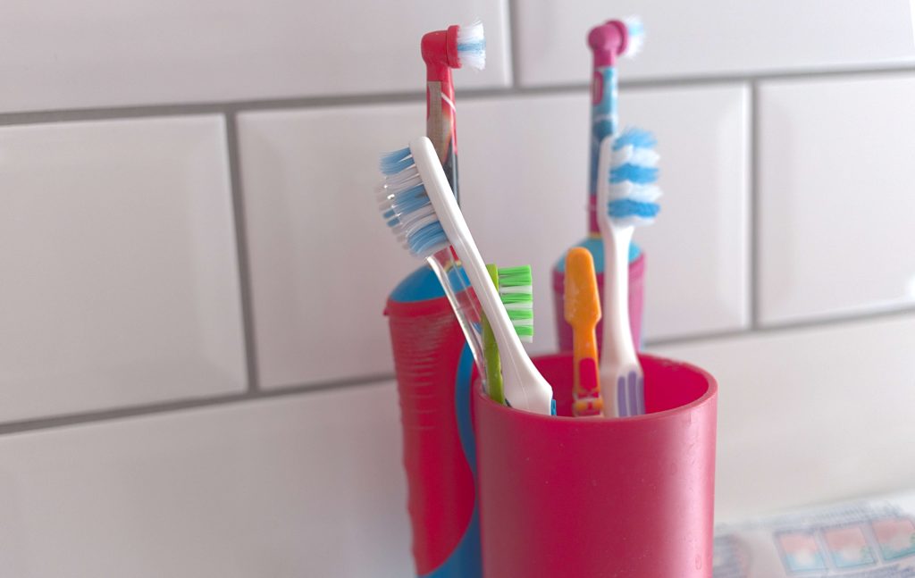 toothbrushes in cups